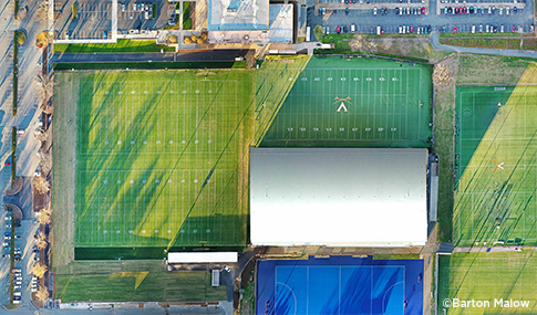 Bird’s eye view of the natural turf practice fields, soccer field and Welsh Indoor Practice Field.