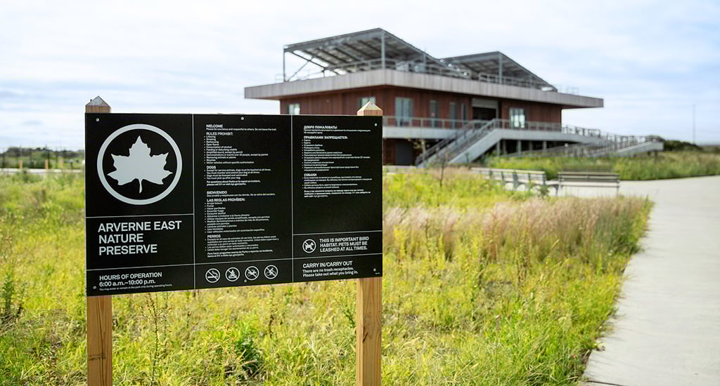 Sign outside of natural setting and path at Averne East.
