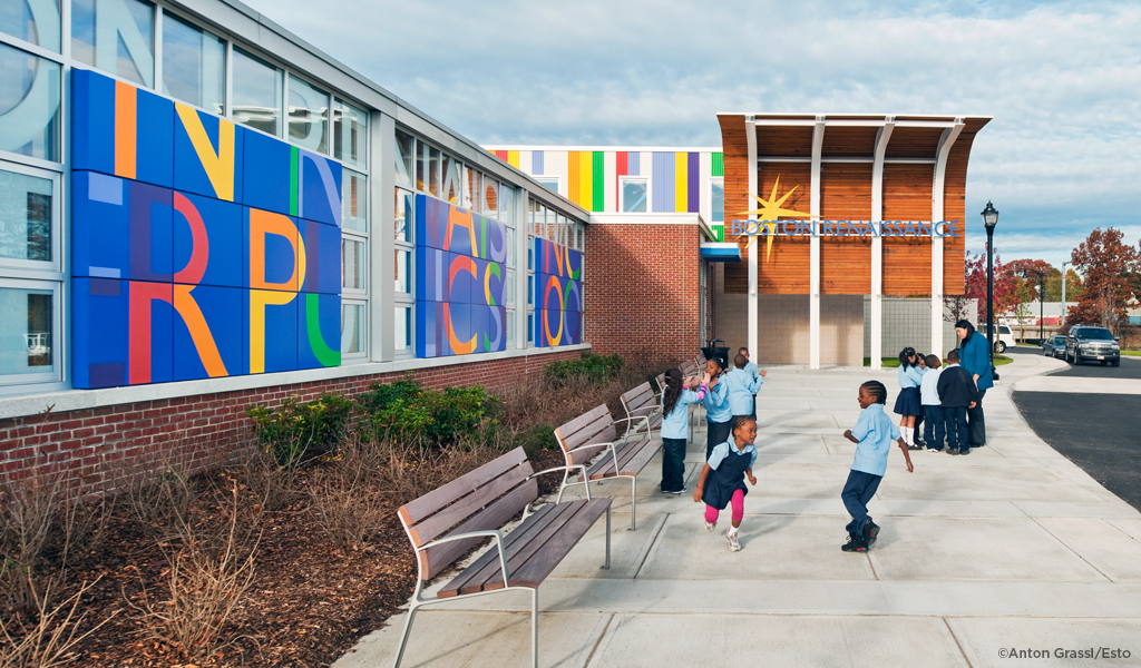 Children standing and playing in front of Boston Renaissance Charter Public School.