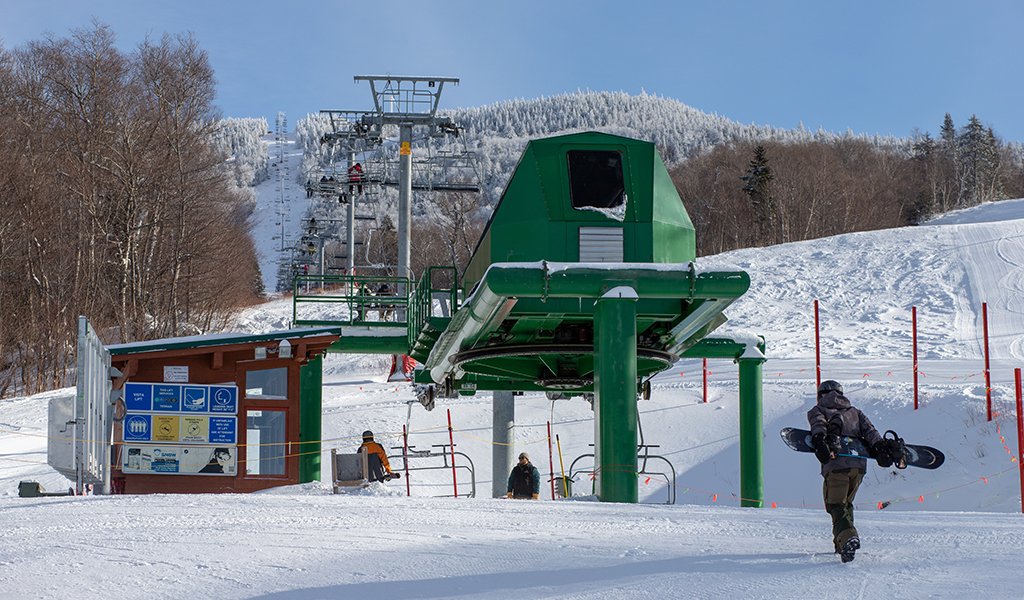 Bolton Valley ski lift and snowboarder.