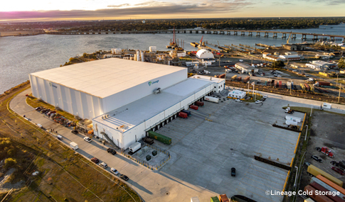 Aerial view of the 167,000 SF cold storage facility with trucks in the bays and adjacent parking sited along the Elizabeth River in Portsmouth, Virginia.