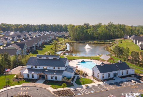 Aerial view of the Chickahominy Clubhouse, outdoor pool, and surrounding homes. 