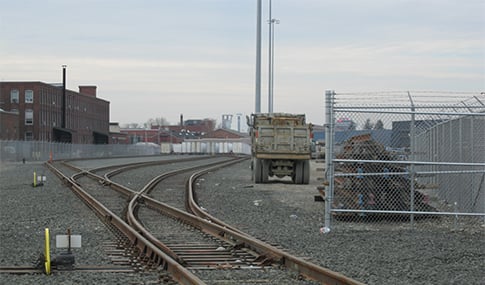 Train tracks and construction vehicle at East Bridgeport Yard in Connecticut