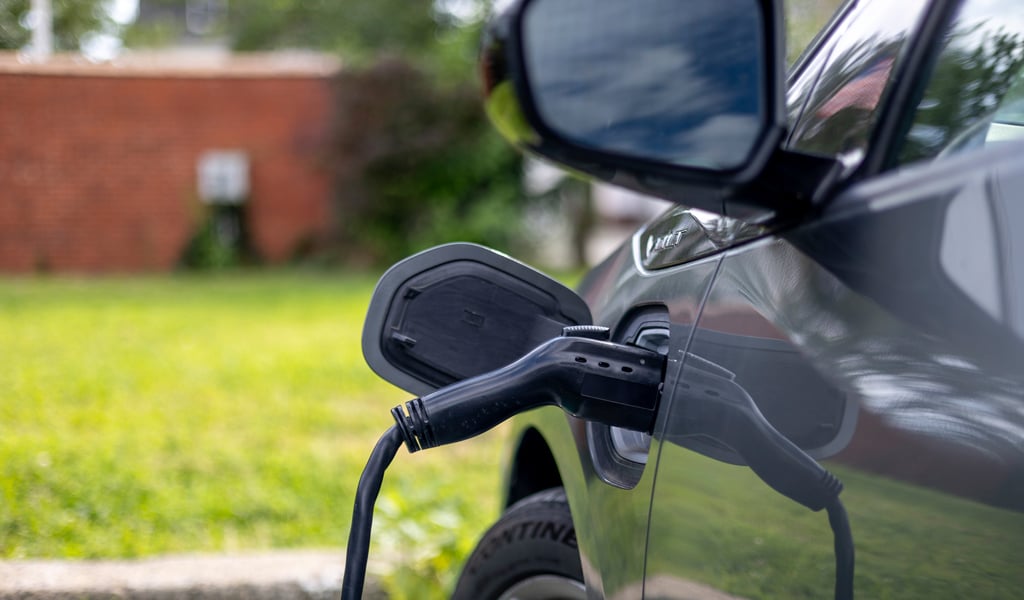 An electric vehicle plugged into a charging station.