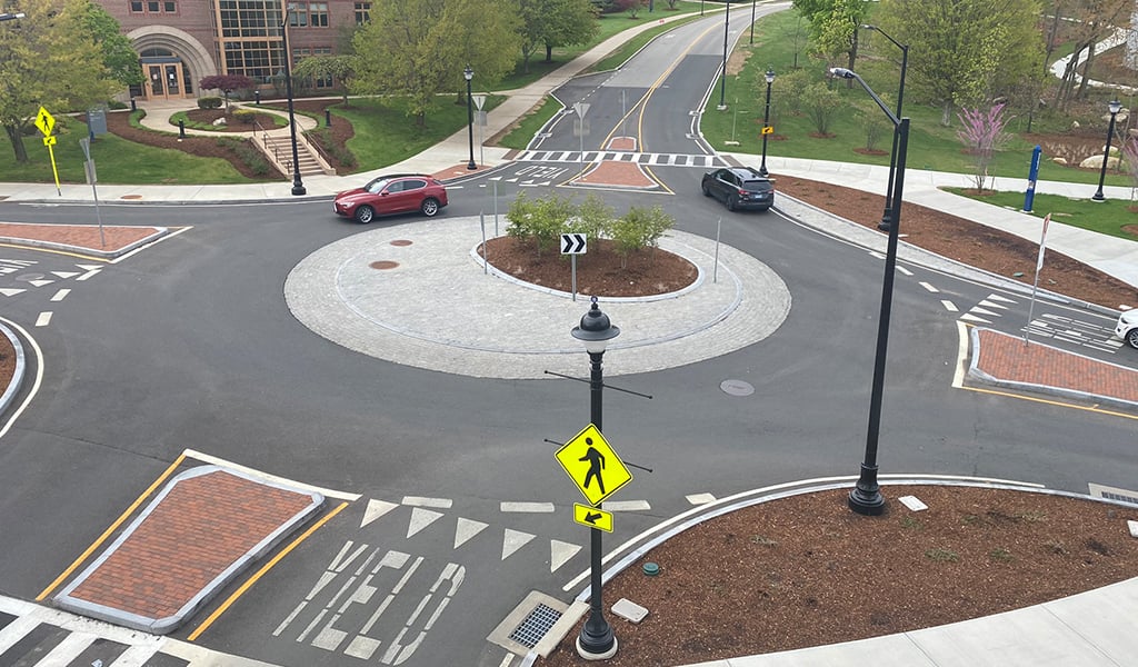 Cars driving around and exiting a roundabout