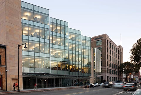 The Novartis Institutes for Biomedical Research is seen from across Massachusetts Avenue. A view of the gateway into the Novartis Institutes for Biomedical Research at dusk.