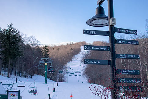 Sugarbush ski lift with wayfinding signs.