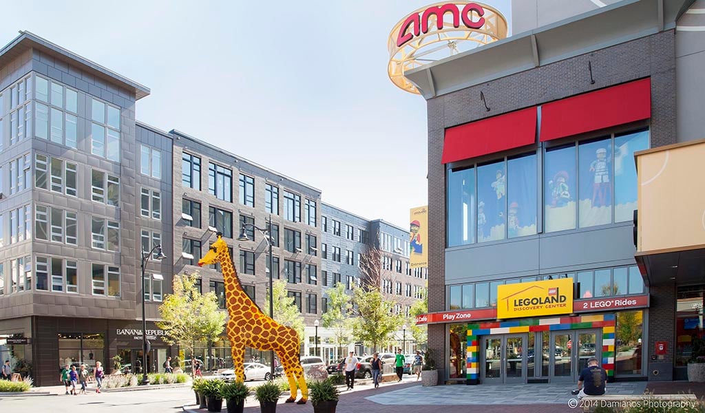 A giraffe statue welcomes visitors outside of the Lego store at Assembly Row.