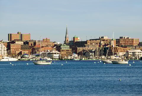 Portland, Maine skyline with city and ocean surrounding.