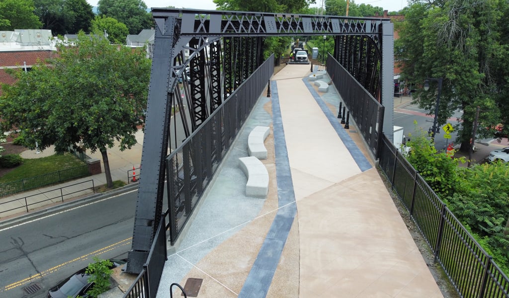 Aerial view of a rehabilitated railroad bridge turned rail trail. 