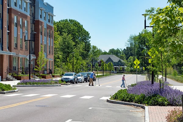 Pedestrians use a crosswalk in downtown Burlington, VT