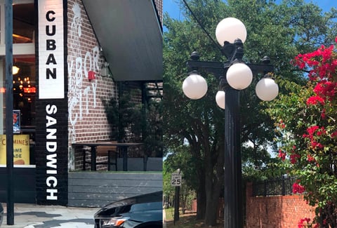 A restaurant in with a brick wall and signage that reads Cuban Sandwich