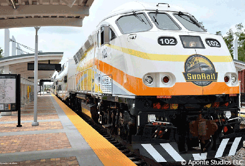 A SunRail train engine waits at a station.