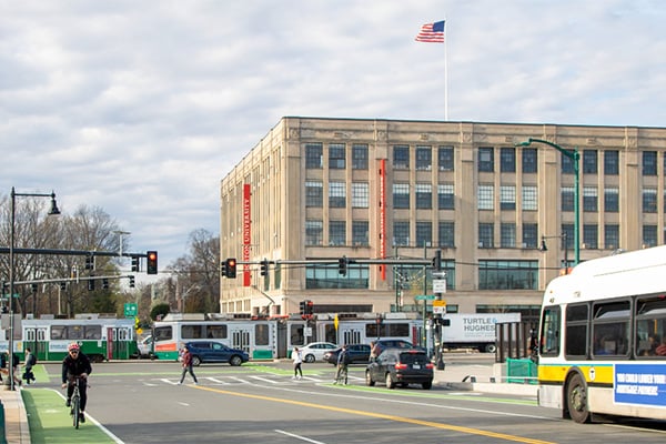 Commonwealth Avenue in Boston features pedestrians, bicyclists, cars, buses, and transit.