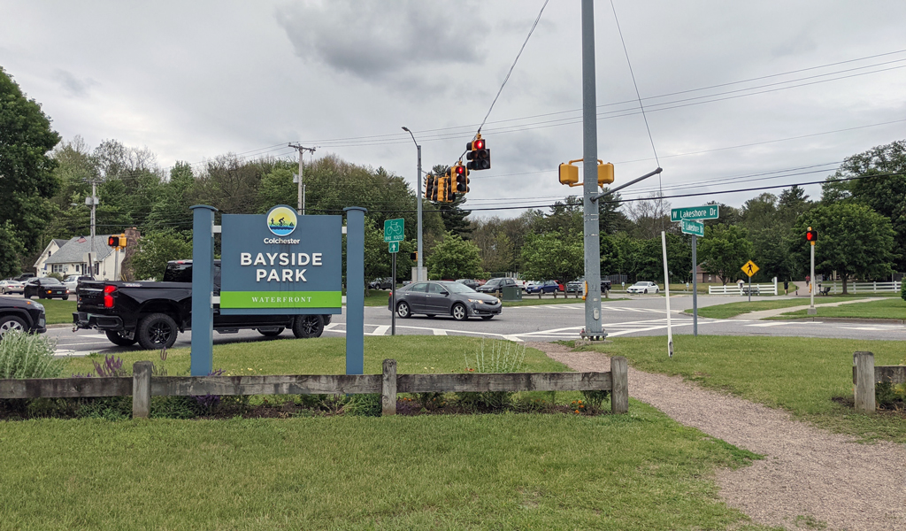 Traffic intersection and entrance sign to Colchester's Bayside Park Waterfront area.