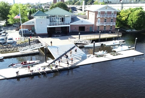 A crew team prepares to row from the Martson Boathouse dock.