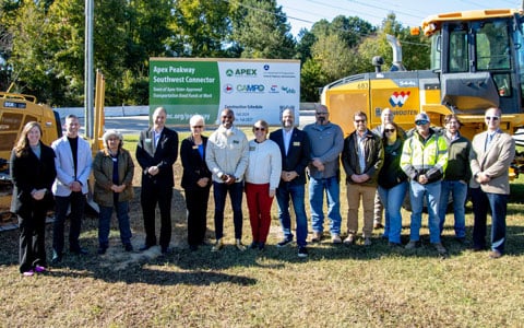 The consultant project team holds shovels to move dirt at the groundbreaking.