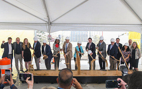 Key team members break ground at the ceremony.