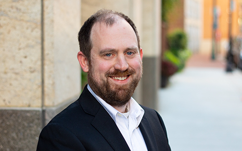 Mike Lowder in a white shirt and black blazer.