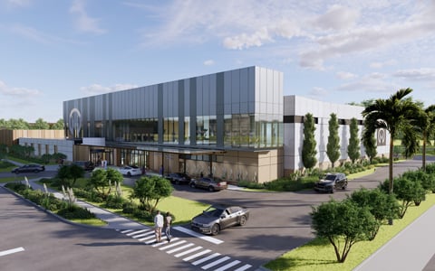 Color rendering of a two-story healthcare building with tropical plantings.