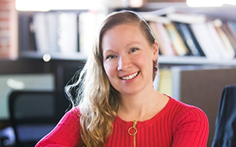 Skye Levin at a table in a VHB office.