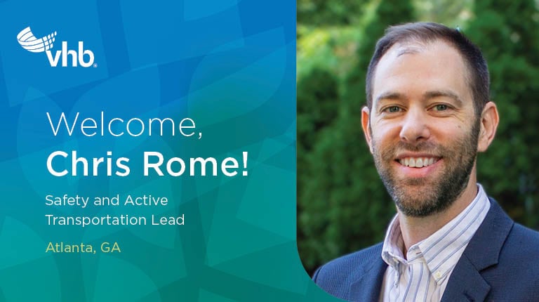 Chris Rome smiling in an office setting.