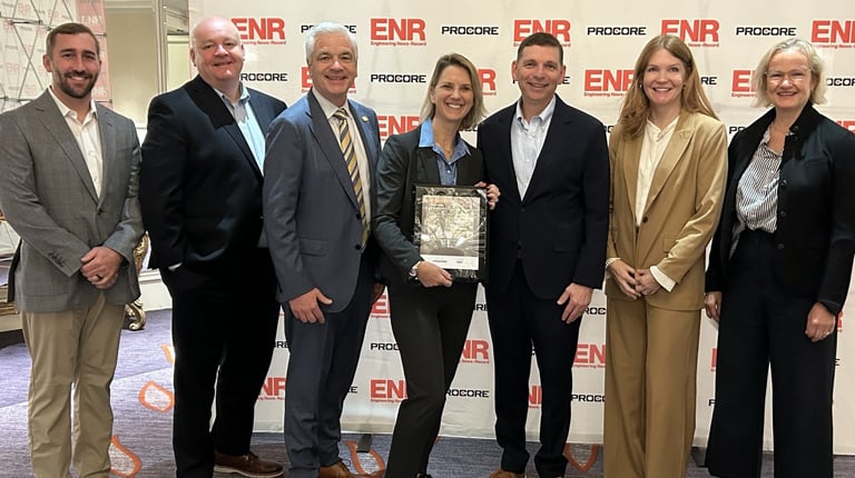 Leaders Seth Lattrell, Chris Lovett, Mike Carragher, Meredith Avery, Tom Jackmin, Kristine Zimmerman, and Elizabeth Grob accept VHB’s awards.