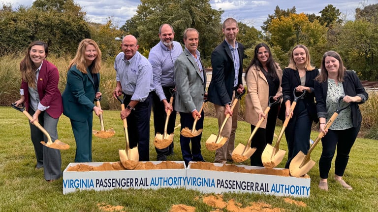 The VHB Long Bridge team smiles at the camera at the groundbreaking ceremony with shovels in hand.