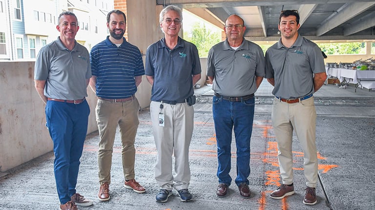 Joe Wanat, Andrew MacPherson, David Wilcock, Jim Long, and Drew Dommel at the topping off ceremony.