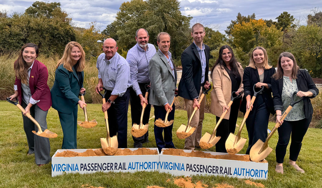 Nine VHBers, including Kevin, hold shovels at the groundbreaking ceremony of Long Bridge.