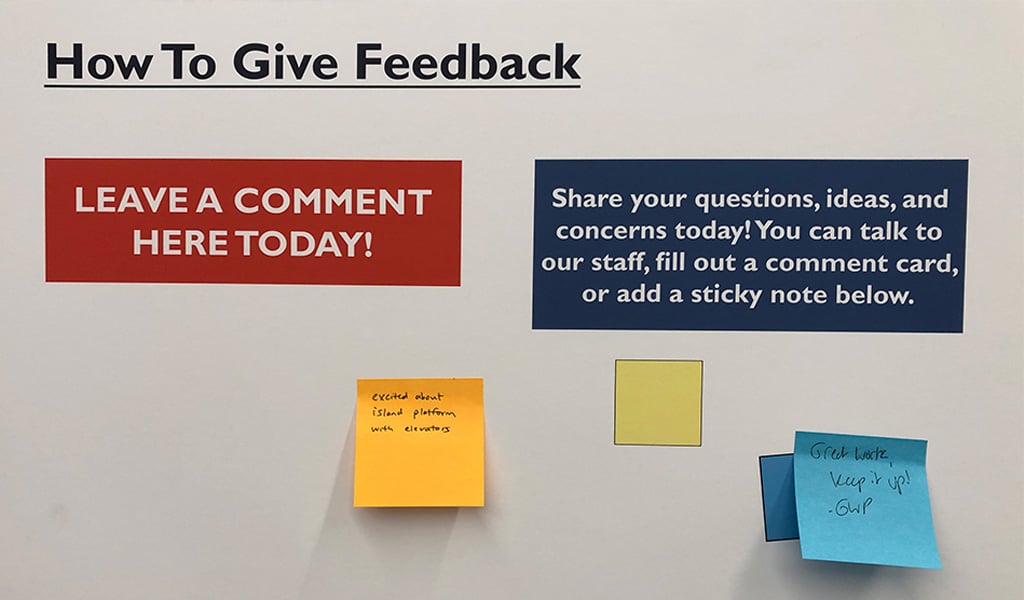 Sticky notes that contain comments are posted on a feedback board.