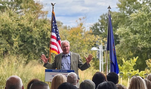 Senator Tim Kaine gives a speech at the podium. 