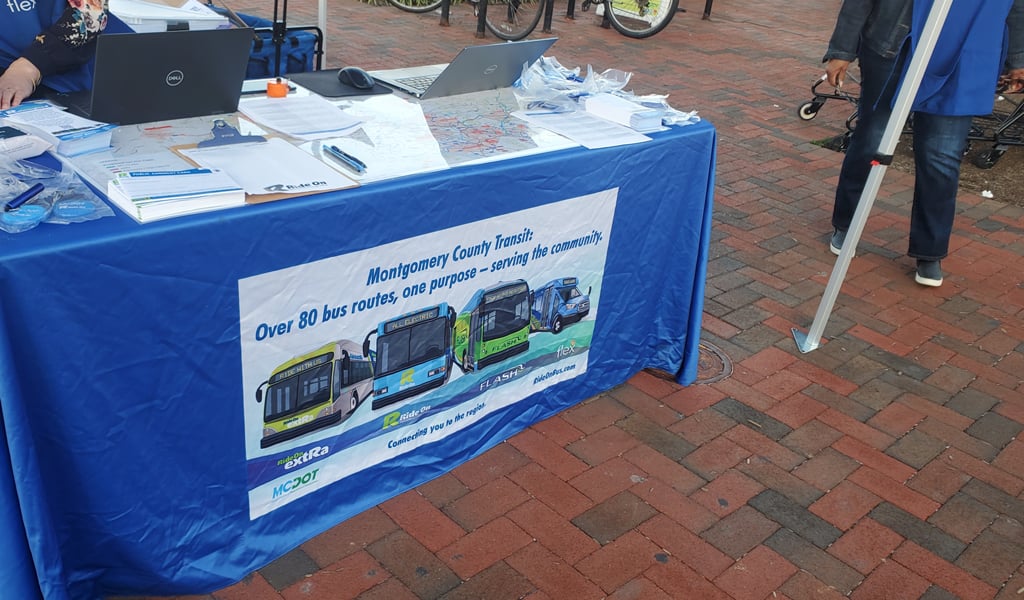 A table with a MCDOT banner at a past public engagement event. 