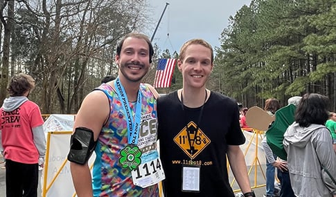 Two race participants after the race with their medals.