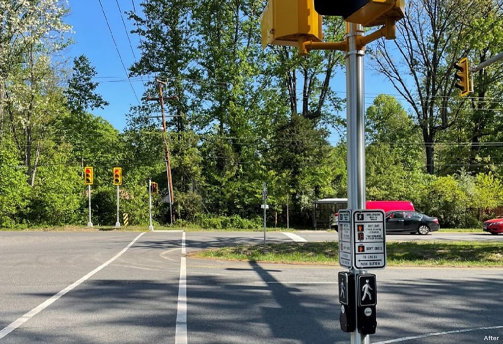 An after image of the same intersection with crosswalks and pedestrian signals added.