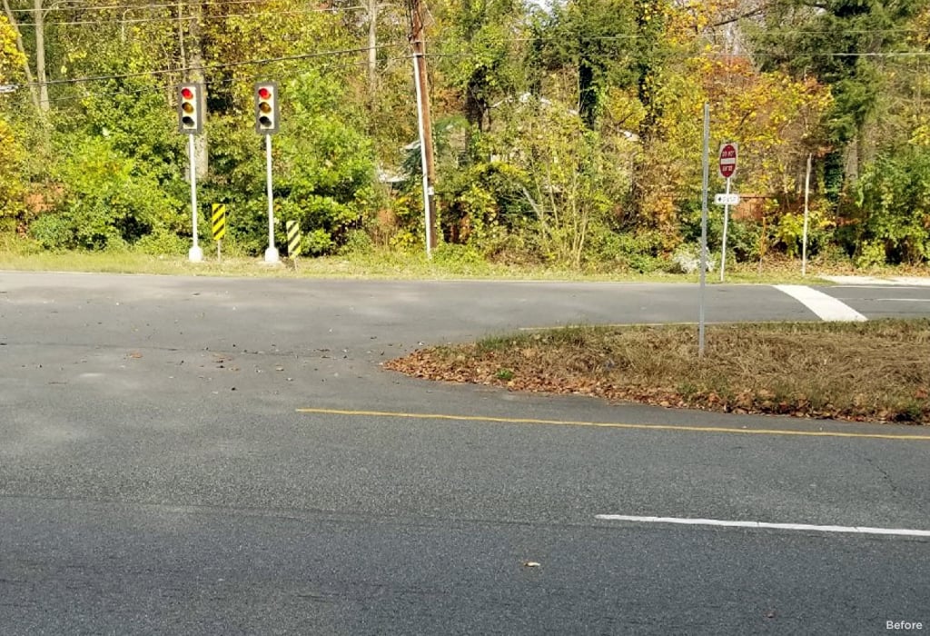 An intersection before any pedestrian accommodations were added.