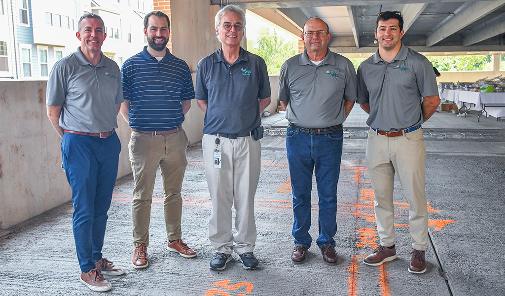 (From L to R) Joe Wanat, Andrew MacPherson, David Wilcock, Jim Long, and Drew Dommel at the topping off ceremony.