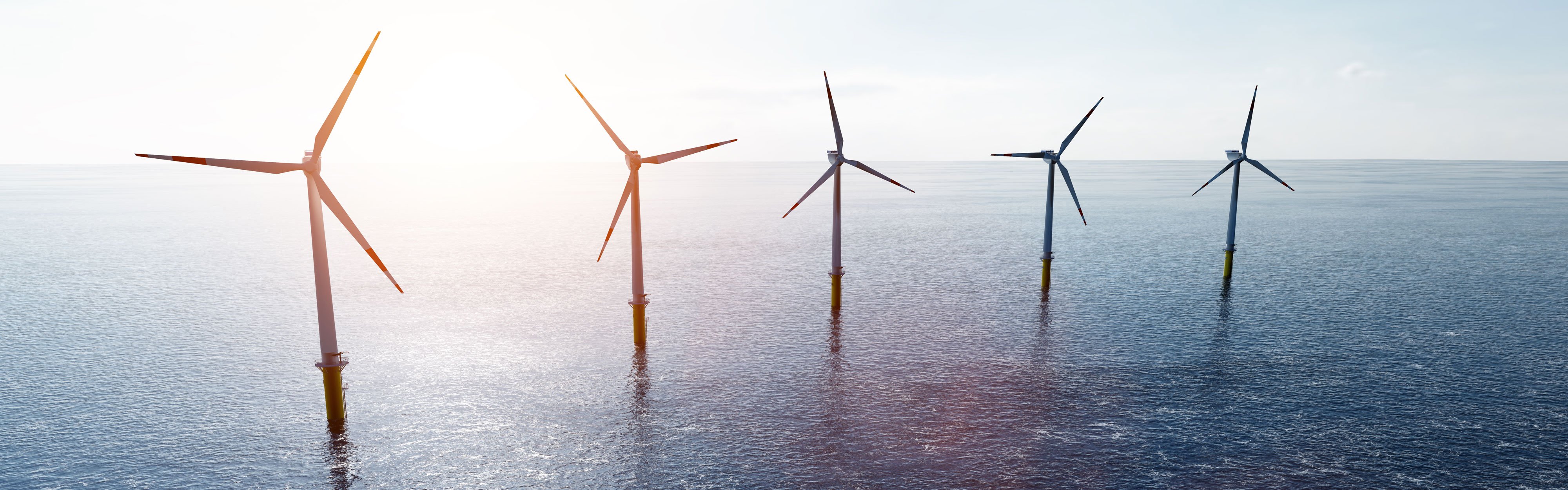 Offshore wind turbines farm on the ocean. 